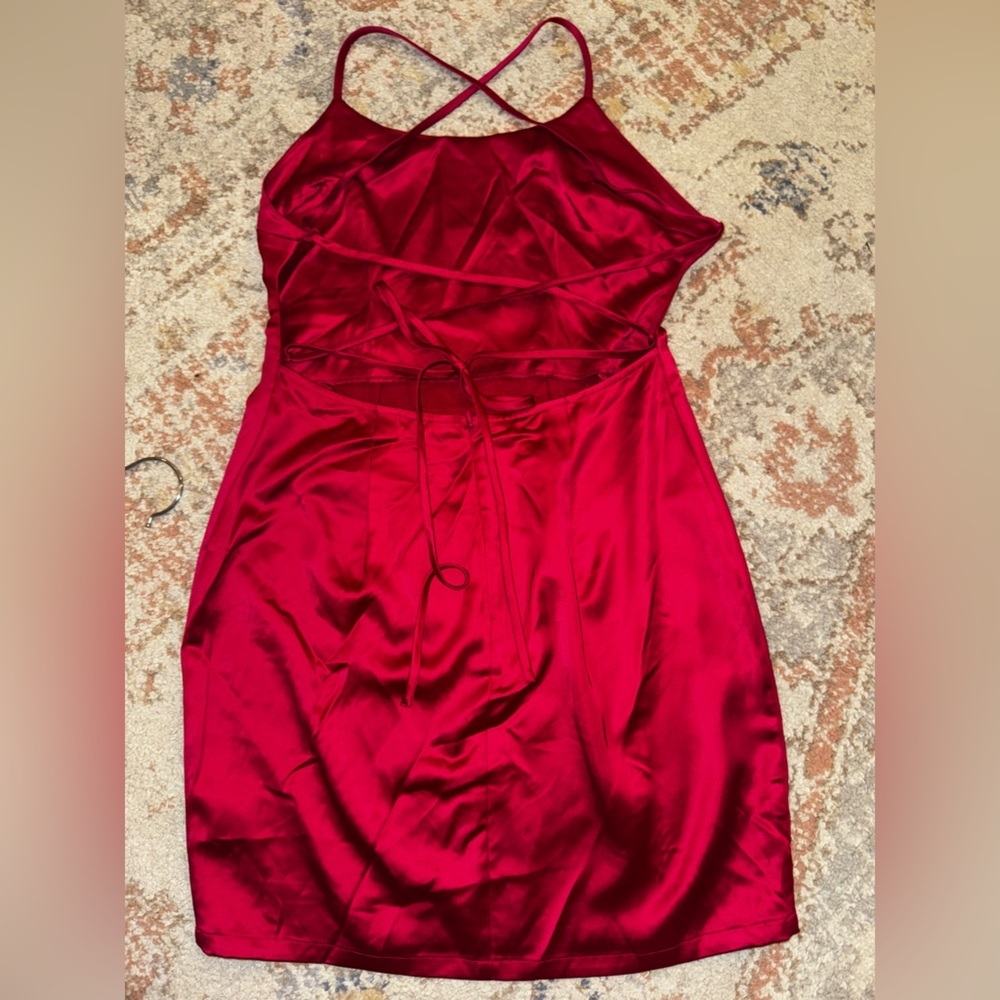 Revolve About Us pink dress with cross cross in the back
